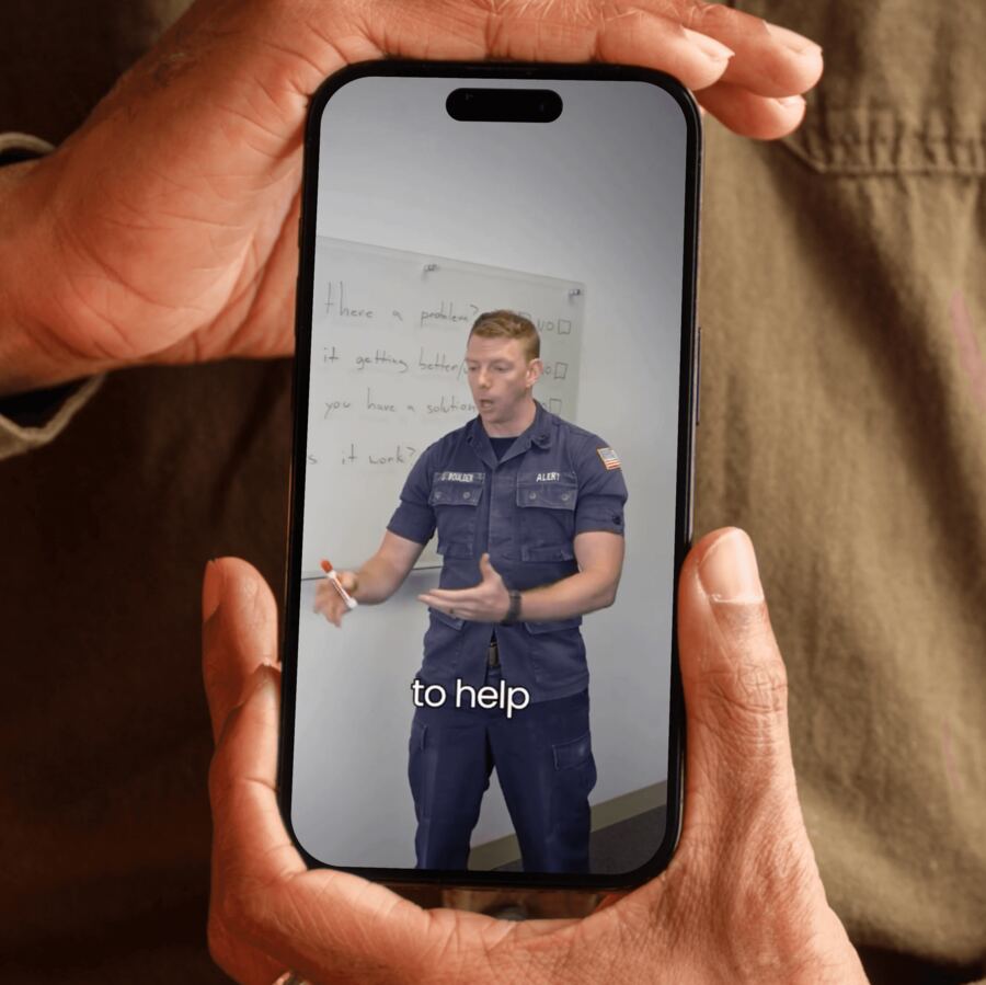 Phone showing short-form video content for a military client